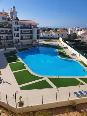 a large swimming pool on the roof of a building at GA-DAL Stay Inn in Albufeira