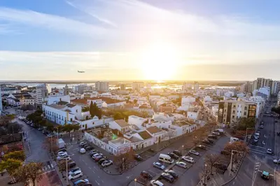 an aerial view of a city at sunset at Skyline Blue Dream in Faro