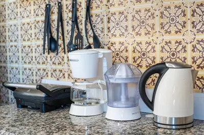 a kitchen counter with several appliances on a counter top at Sea View Fairy Tale in Faro
