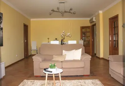 a living room with a couch and a table at Vilamoura, Marina Sol T1 in Quarteira