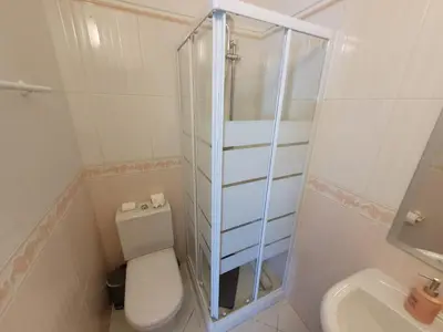 a white bathroom with a toilet and a sink at Algarve Villa Albufeira Altos dos Caliços in Albufeira