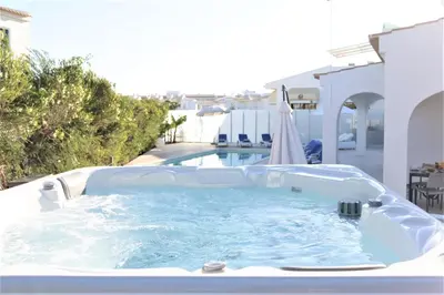 a large jacuzzi tub sitting next to a pool at Villa Namora - Private Swimming pool & Hot Jacuzzi in Albufeira