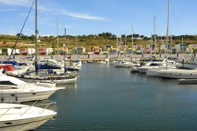 a bunch of boats docked in a harbor at Villa White Sands - Private Oasis, Heated Pool, Beaches & Strip Nearby in Albufeira