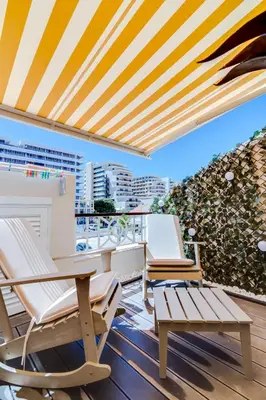 a balcony with chairs and tables and a view of the ocean at Gold Suites - Luxurious apartment - Sea view in Vilamoura