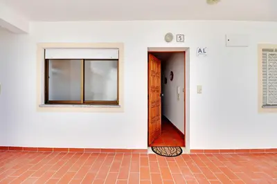 an empty room with a door and a window at Albufeira Beach 1 by Homing in Albufeira