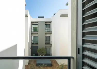 a view of a building from a balcony at BmyGuest - Cavalo Preto Beach Apartment in Loulé