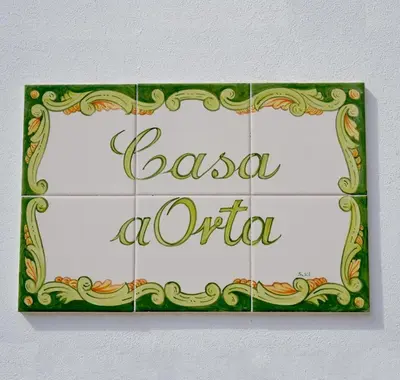 a sign with the words b salsa a otula at Casa aOrta in Faro