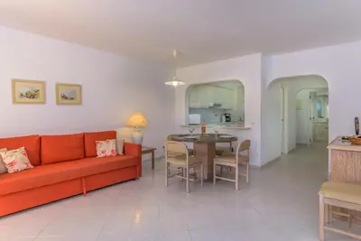 a living room with a couch and a table at FLH Balaia Village Apartment with Pool I in Olhos de Água