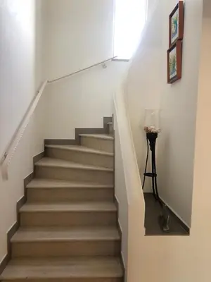 a stairway with a stair case in a house at Casa Netos in Galé