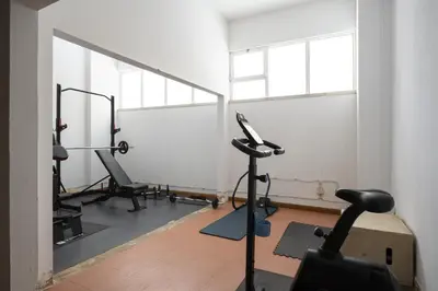 a room with a gym with exercise equipment in it at Marina Mar - Near the beach - Vilamoura in Vilamoura