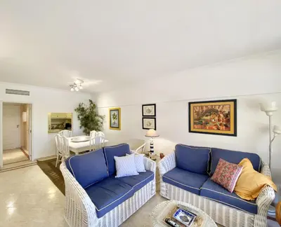 a living room with two blue couches and a table at Marina Mar - Near the beach - Vilamoura in Vilamoura