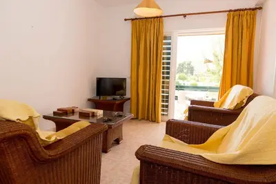 a living room with two couches and a television at TAC - Vilamoura Center in Vilamoura