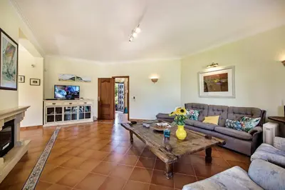 a living room with a couch and a table at Villa Hideaway by Algarve Villa Holidays in Galé