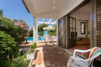 a living room with a couch and a table at Villa EP in Albufeira