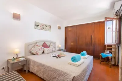 a living room with two couches and a fireplace at Villa EP in Albufeira