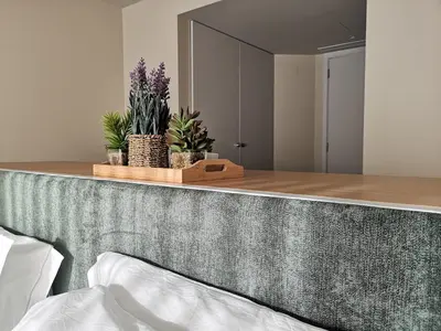 a bedroom with a counter with plants on it at Victory Village 16F in Quinta do Lago