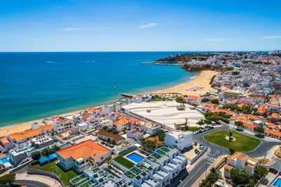an aerial view of a city and the beach at Praia Mar by OCvillas in Albufeira