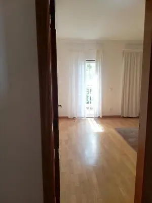a hallway with a door open to a room at Villa V2 AA in Olhos de Água