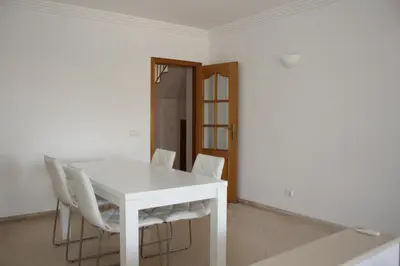 a living room with a couch and a table at Villa V2 AA in Olhos de Água