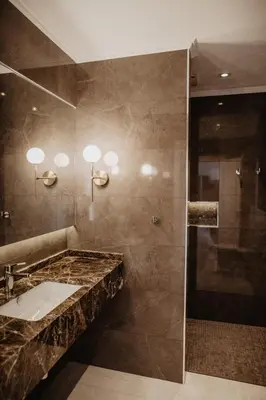 a bathroom with a sink and a shower at Granvila in Quarteira