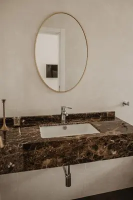 a bathroom with a sink and a mirror at Granvila in Quarteira