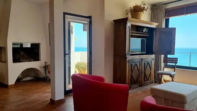 a living room with a view of the ocean at Albufeira Beach Cliffs House in Albufeira