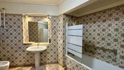 a bathroom with a sink and a mirror at Beira Mar by Check-in Portugal in Albufeira