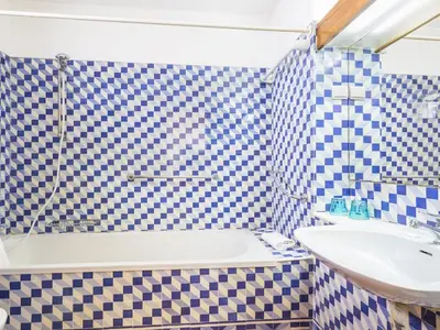 a bathroom with a sink and a bath tub and a sink at Villa Villa Jacaranda V3 by Interhome in Albufeira
