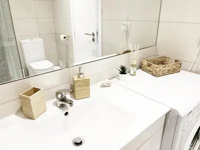 a bathroom with a sink and a mirror at Seaview Studio - 10 Min. Beach, Private Condo, Pool, Grill & Free Parking in Albufeira