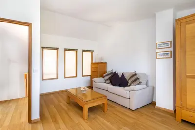 a living room with a couch and a coffee table at Vilamoura Oasis Family Duplex in Vilamoura