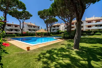 a swimming pool in the yard of a apartment at Vilamoura Oasis Family Duplex in Vilamoura