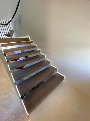 a staircase with wooden treads in a house at Vilamoura Marina Mezzanine Loft in Vilamoura
