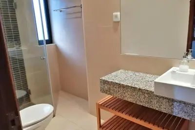 a kitchen with a sink and a stove top oven at Villa Azevedo in Vilamoura