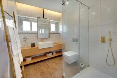 a bathroom with a sink and a toilet and a shower at Apartamento Boavista - Sea View by DreamvillasAlbufeira in Albufeira