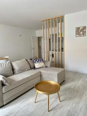 a living room with a couch and a table at White Sand Apartments Downtown Albufeira in Albufeira