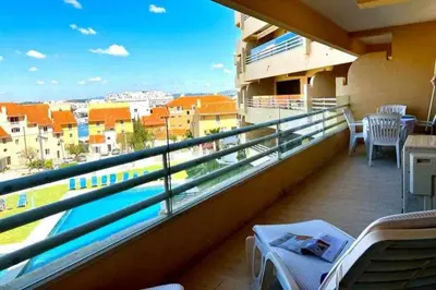 a balcony with a view of a city at Marina Mar by FHR piscina, parking in Quarteira