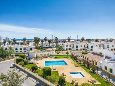 an aerial view of a house with a swimming pool at Nuances do Oceano by OCvillas in Albufeira
