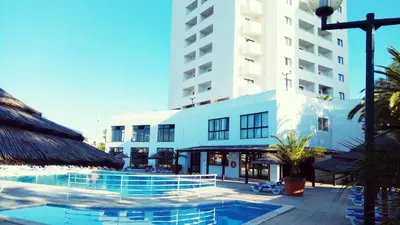 a hotel with a swimming pool in front of a building at Albufeira 603 in Albufeira