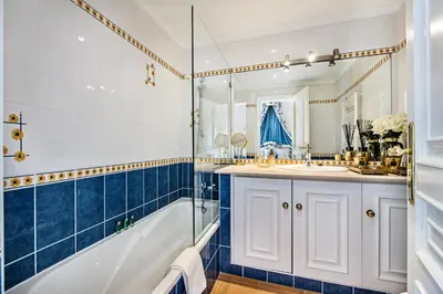 a bathroom with a tub and a sink and a shower at Rosal 27 by Algarve Villa Holidays in Albufeira