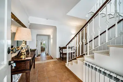 a home office with a desk and stairs at Rosal 27 by Algarve Villa Holidays in Albufeira