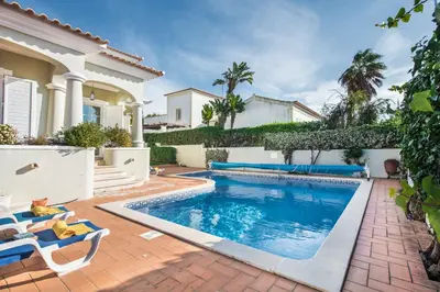 a swimming pool in the backyard of a house at Rosal 27 by Algarve Villa Holidays in Albufeira