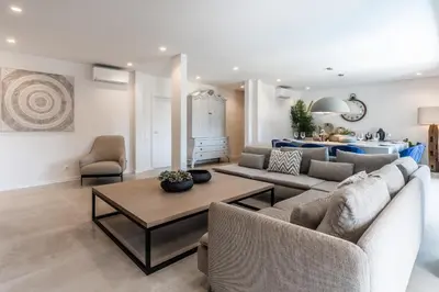 an empty corridor with white walls and a white hallway at Vila Hibisco by Garvetur in Vilamoura