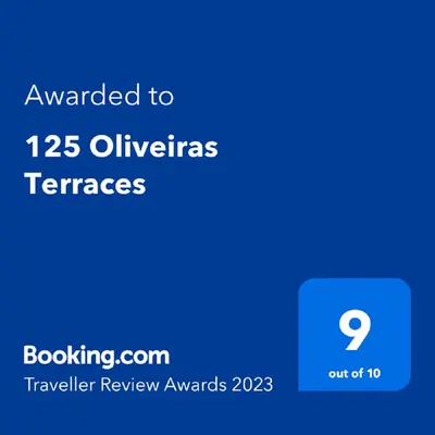 a screenshot of a phone with the text awarded to olivias terraces at 125 Oliveiras Terraces in Albufeira