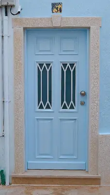 a blue door on the side of a building at Velha 34 in Albufeira