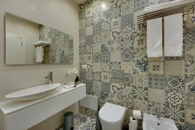 a bathroom with a sink and a toilet at Casa da Bandeira -Perfect Location-Beach front- Rooftop Pool by DreamvillasAlbufeira in Albufeira