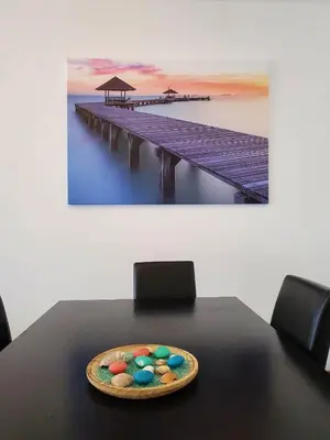 a plate of cookies on a table next to a pier at 