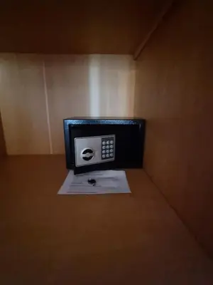 a small box with a phone sitting on a table at Luxury city Villa Olivia 10 - 15 min to the Beach Oura, private swimming pool in Albufeira