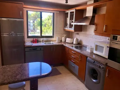 a kitchen with a sink and a dishwasher at Praia da Falésia - Falesia Beach - Apartment Pine Sun Park in Albufeira