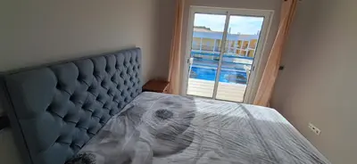a bedroom with a bed and a dresser in it at Encosta S. José -Vale Parra in Albufeira