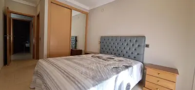 two twin beds in a room with a picture on the wall at Encosta S. José -Vale Parra in Albufeira